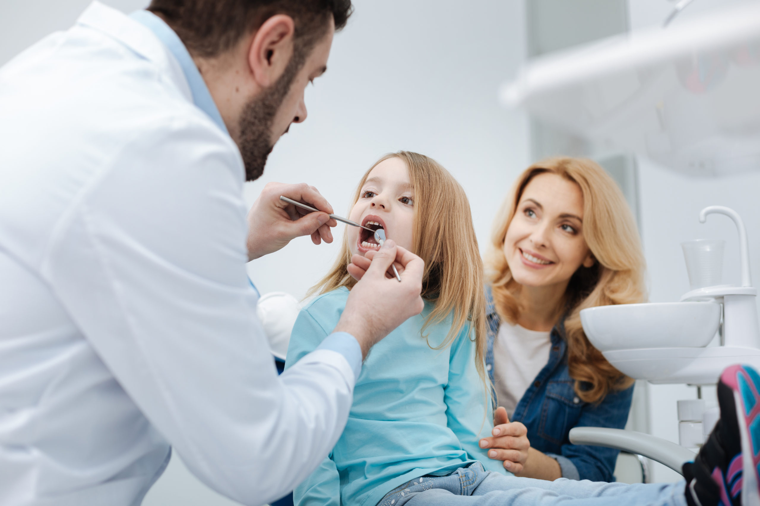 dentist examining a child's teeth