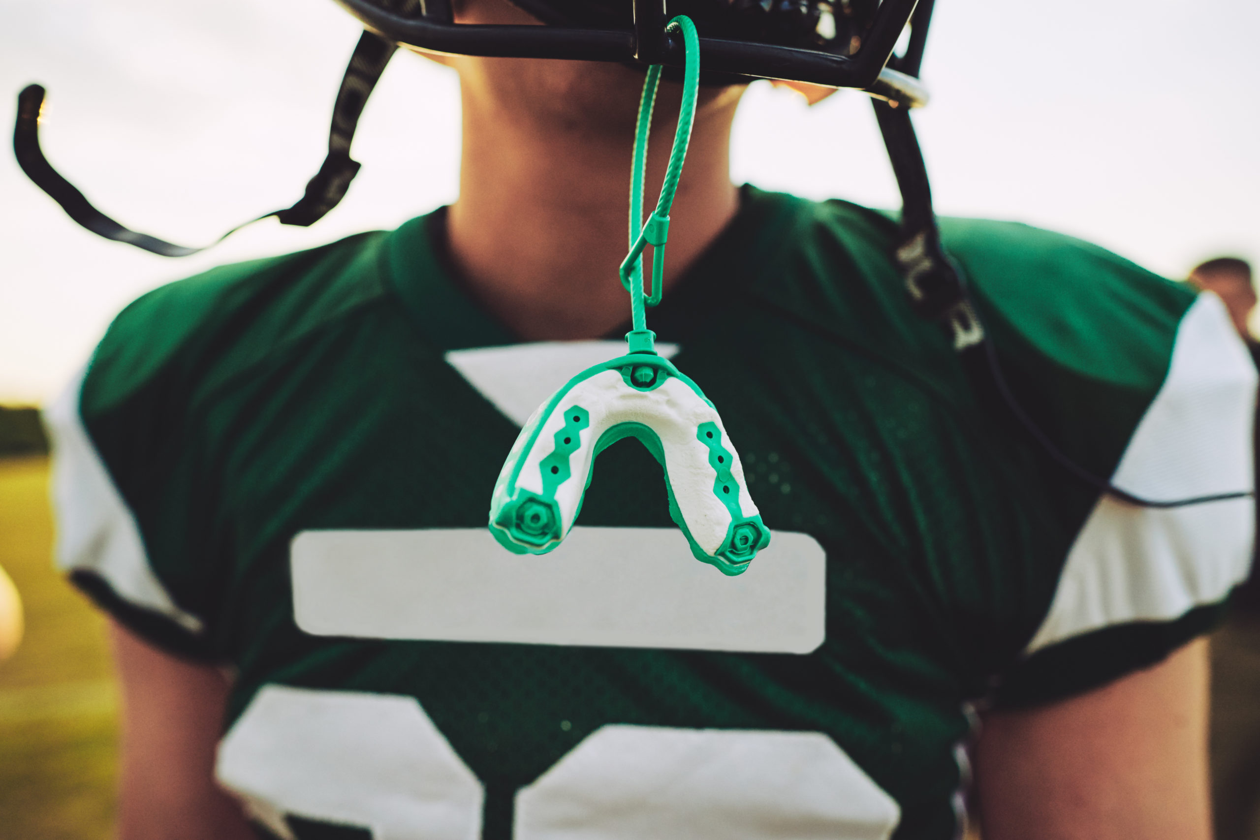 mouth guard hanging from a football helmet